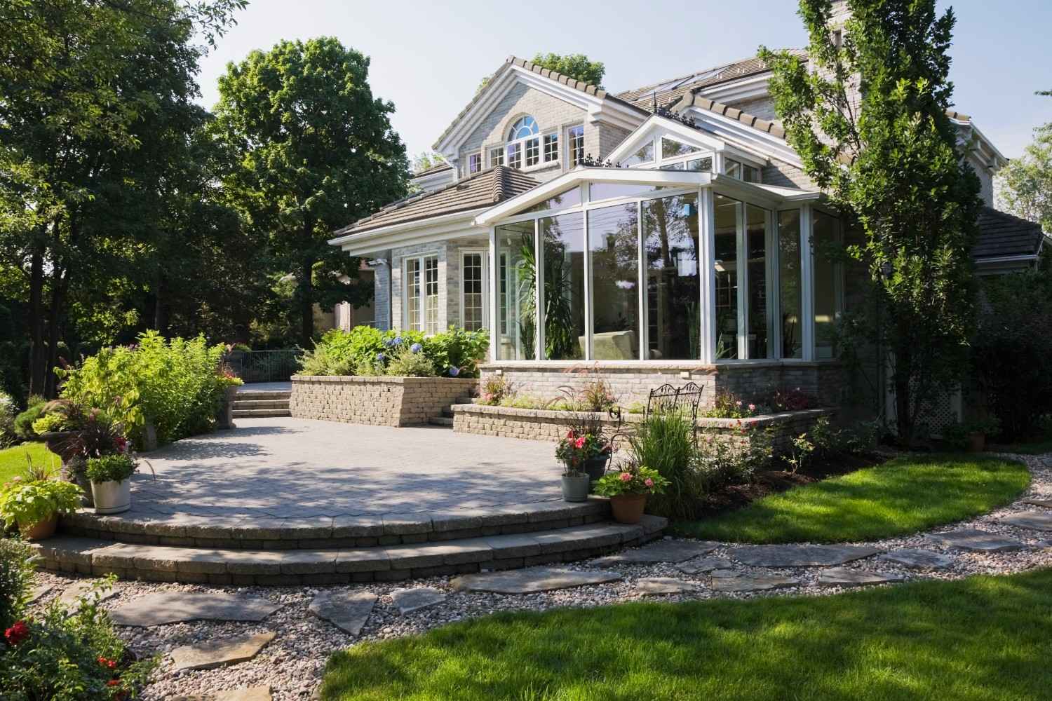 Luxury home exterior with glass solarium